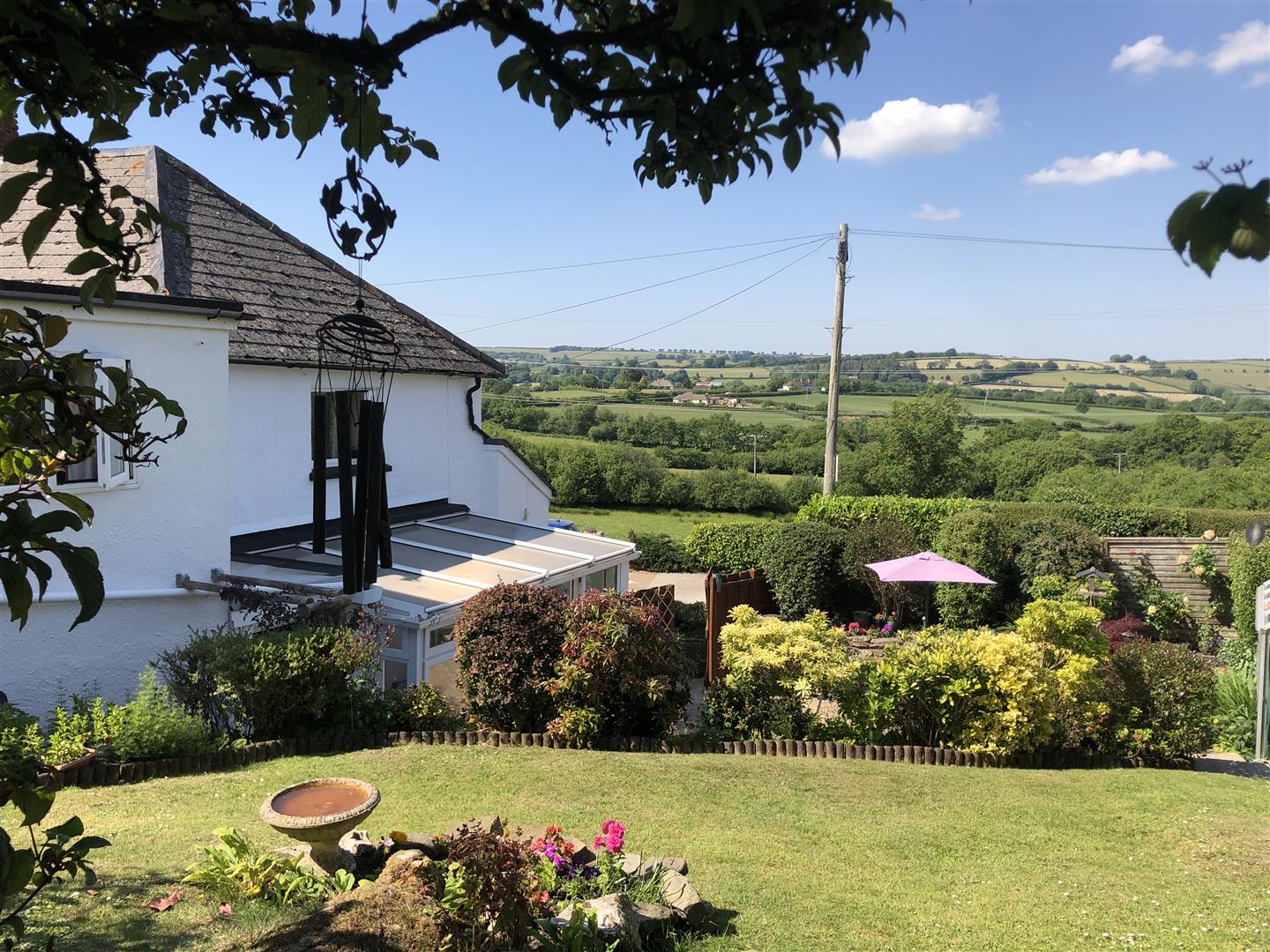 A LOVELY EXAMPLE OF A SEMI DET COTTAGE WITH A VERY PRETTY GARDEN AND