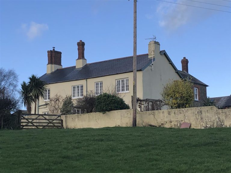 A south facing farmhouse with two cottages 40 acres and a large